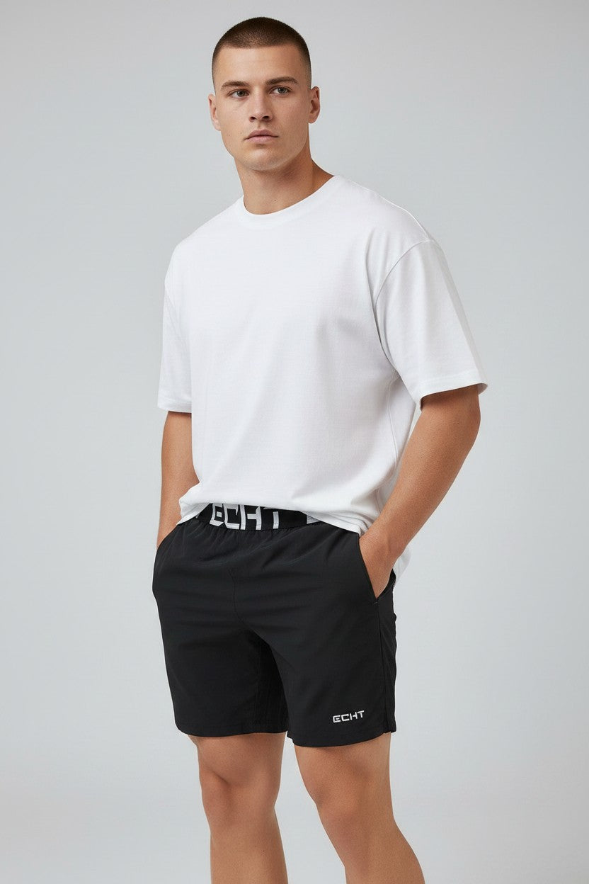 COHYX LLC black polyester fiber training running shorts with branded waistband and side pockets.